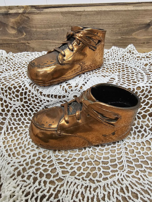 Pair of bronzed shoes