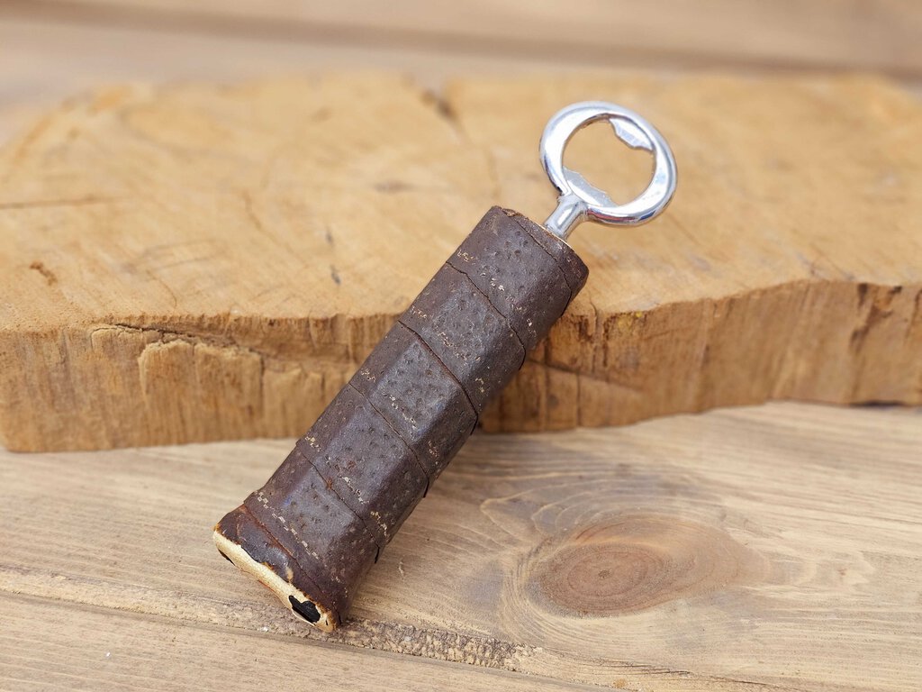 Bottle opener made from vintage tennis racquet handle