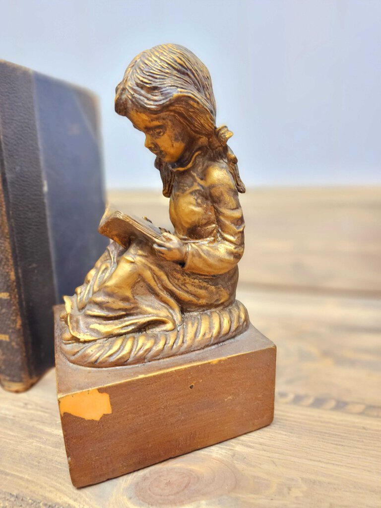 Vintage boy and girl reading bookends