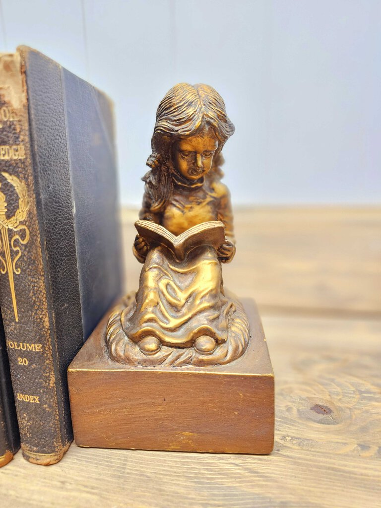 Vintage boy and girl reading bookends