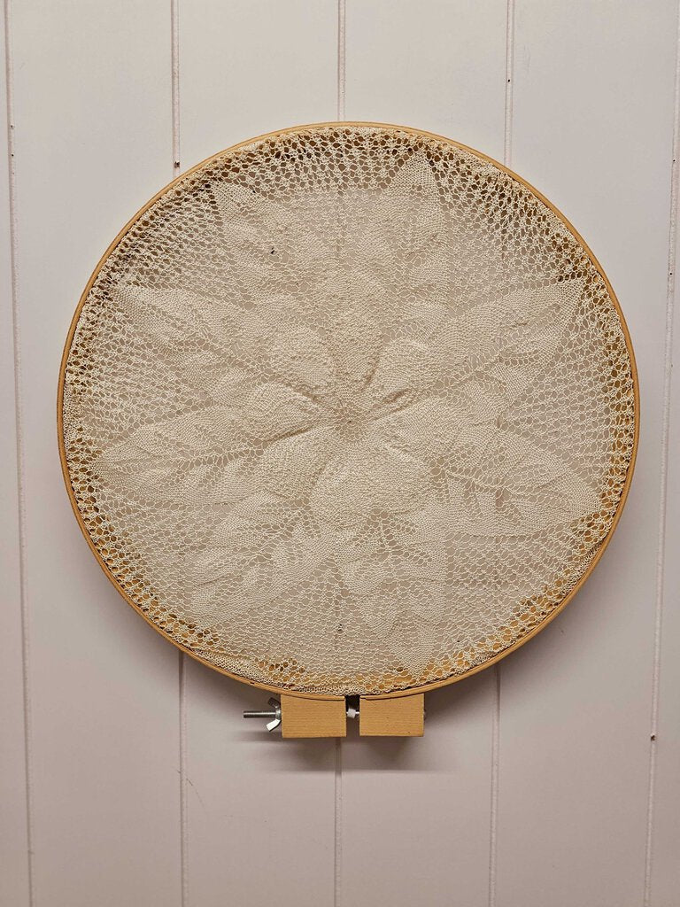 Vintage hand-crocheted doily in embroidery hoop